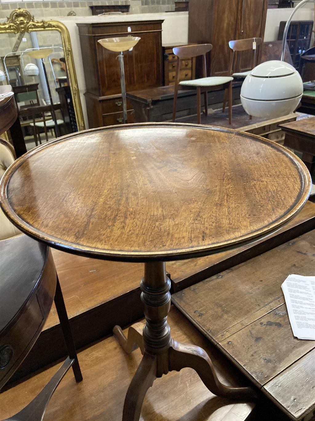 A George III mahogany corner washstand, width 58cm, depth 40cm, height 83cm together with a circular mahogany tripod wine table, diamet